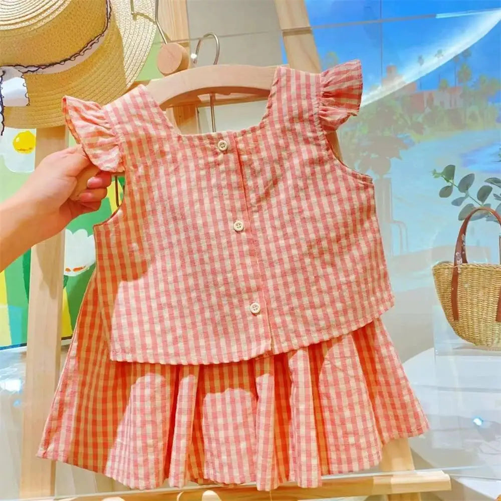 Trending! Conjunto de dos piezas de verano para niña, a cuadros roja con lazo.