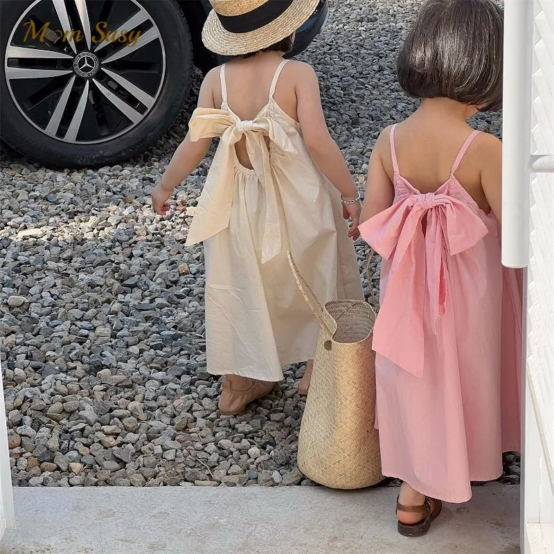 Estiloso vestido de tirantes para niña, con lazo en espalda, perfecto para el verano