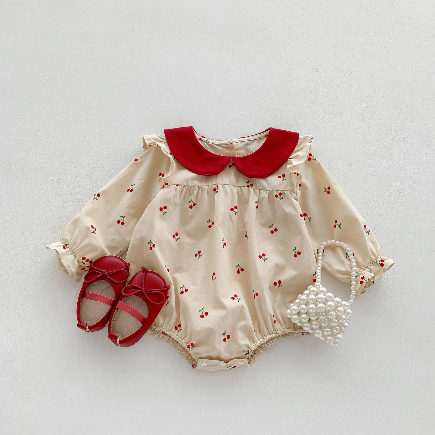 Precioso bombacho Vintage para bebé niña, enterito con cuello Peter Pan y estampado de cerezas para niñas pequeñas, Outfit de otoño invierno y de primavera verano para niñas