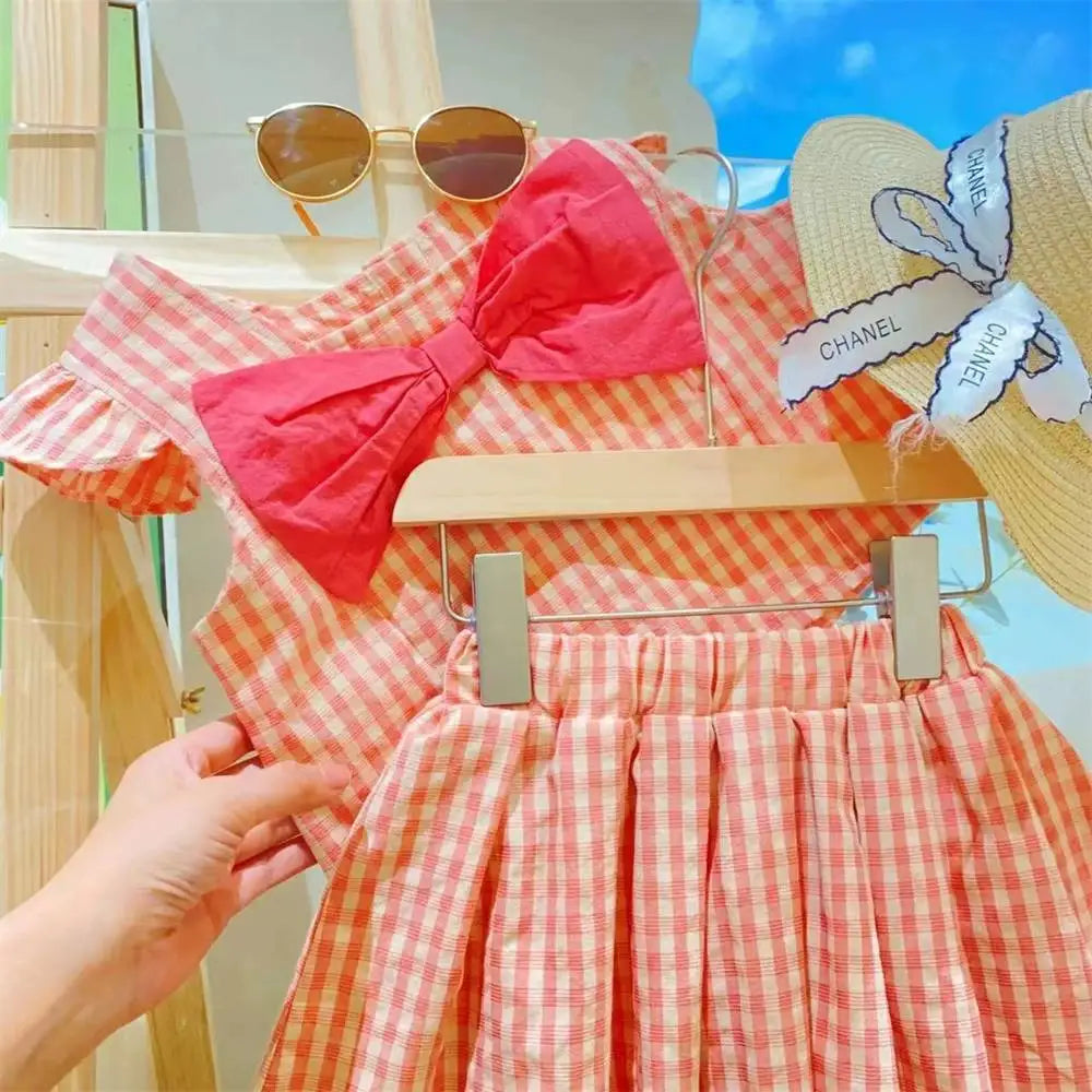 Trending! Conjunto de dos piezas de verano para niña, a cuadros roja con lazo.