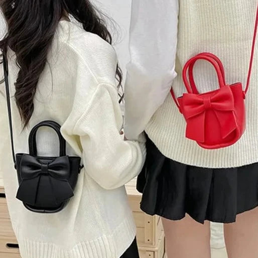 Bolso de hombro o correa cruzada para niña, con hermoso y gran lazo