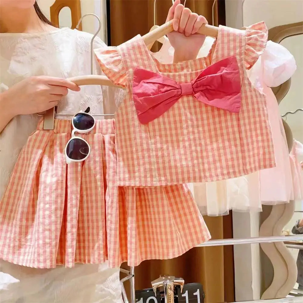 Trending! Conjunto de dos piezas de verano para niña, a cuadros roja con lazo.